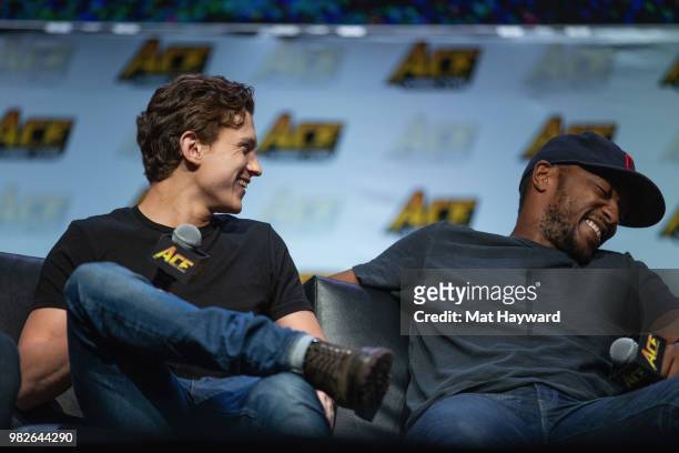 Tom Holland and Anthony Mackie speak on stage during a Civil War Cast conversation at ACE Comic Con at WaMu Theatre on June 23, 2018 in Seattle,...