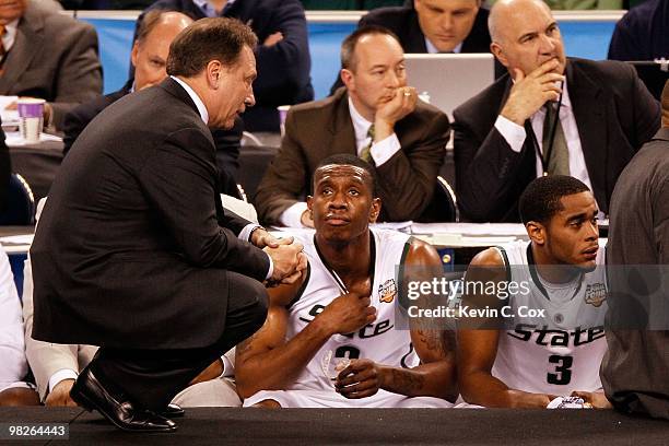 Head coach Tom Izzo of the Michigan State Spartans talks with Raymar Morgan from the sideline while taking on the Butler Bulldogs during the National...