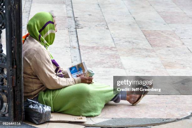 Portugal, Lisbon, Rossio, historic district, Igreja de Sao Domingos, woman begging.