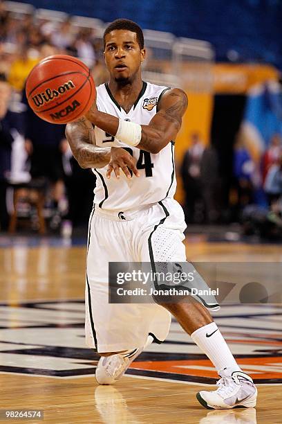 Korie Lucious of the Michigan State Spartans passes the ball against the Butler Bulldogs during the National Semifinal game of the 2010 NCAA Division...