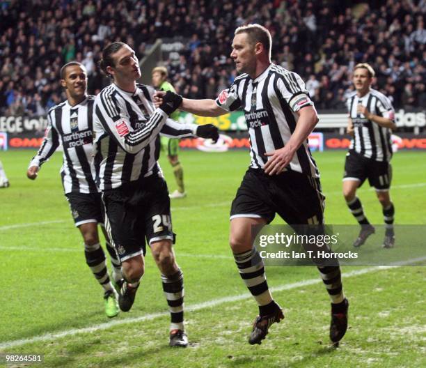 Kevin Nolan of Newcastle United celebrates with Andy Carroll after scoring Newcastle's second goal during the Coca Cola Championship match between...