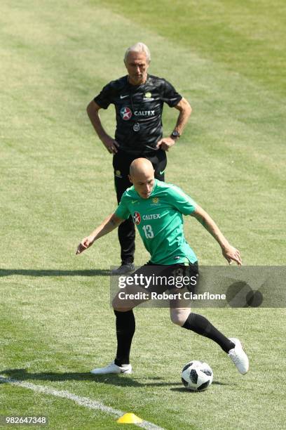 Aaron Mooy of Australia in action as Bert van Marwijk, Head coach of Australia looks on during an Australian Socceroos media opportunity at Stadium...