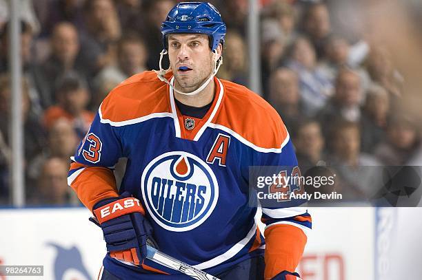 Jason Strudwick of the Edmonton Oilers concentrates on the puck against the Anaheim Ducks at Rexall Place on March 26, 2010 in Edmonton, Alberta,...
