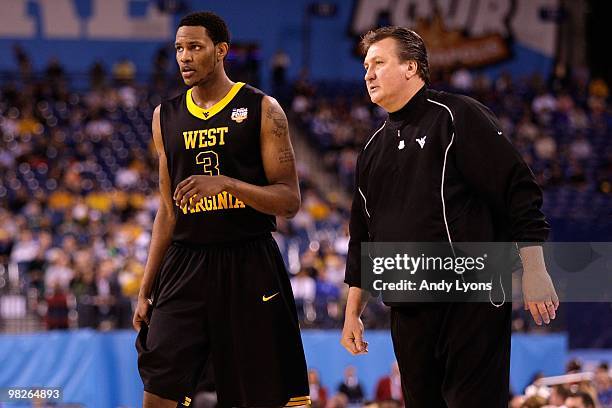 Head coach Bob Huggins of the West Virginia Mountaineers with Devin Ebanks while taking on the Duke Blue Devils during the National Semifinal game of...
