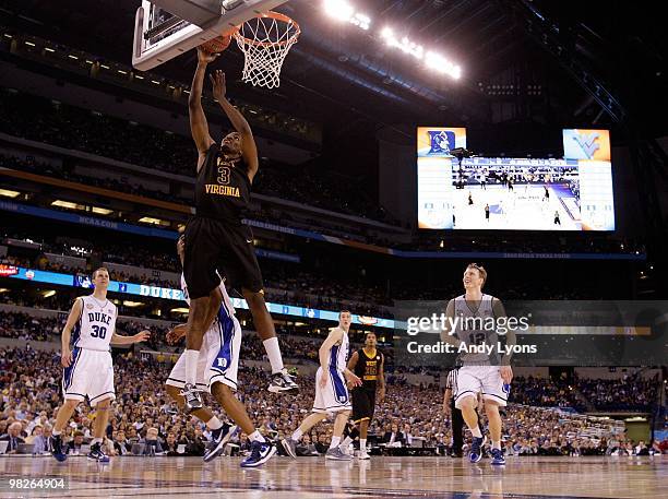 Devin Ebanks of the West Virginia Mountaineers lays the ball up while taking on the Duke Blue Devils during the National Semifinal game of the 2010...