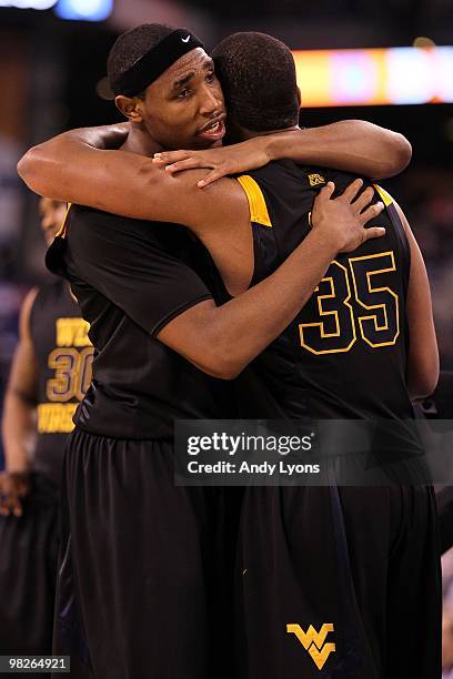 Kevin Jones and Wellington Smith of the West Virginia Mountaineers hug after losing to the Duke Blue Devils during the National Semifinal game of the...