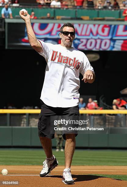 Former Arizona Cardinals quarterback Kurt Warner throws out the ceremonial first pitch before the Opening Day major league baseball game between the...