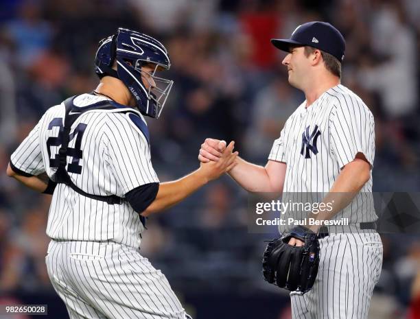 Pitcher Adam Warren and catcher Gary Sanchez of the New York Yankees celebrate after Warren retired the side in the 9th inning to end an MLB baseball...