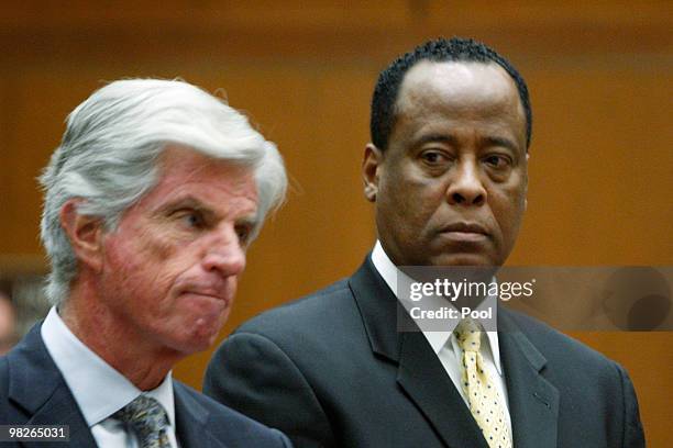 Dr. Conrad Murray stands near defense attorney John Michael Flanagan as he appears at Los Angeles Superior Court on April 5, 2010 in Los Angeles,...