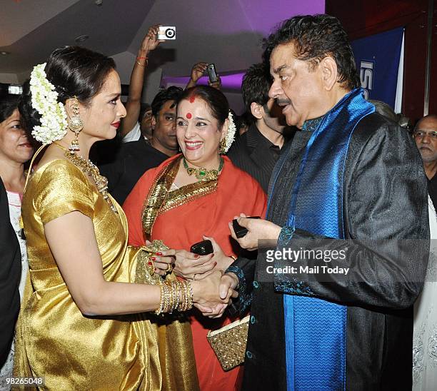 Actress Rekha greets actor Shatrughan Sinha and his wife Poonam at the premiere of the film Sadiyaan in Mumbai on April 1, 2010.
