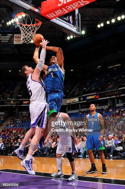 Ryan Hollins of the Minnesota Timberwolves shoots against Andres Nocioni of the Sacramento Kings during the game on March 14, 2010 at ARCO Arena in...