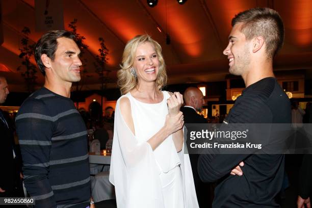 Tennis player Roger Federer, Gerry Weber testimonial international supermodel Eva Herzigova and tennis player Borna Coric attend the Gerry Weber Open...