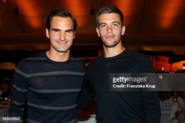 Tennis players Roger Federer and Borna Coric attend the Gerry Weber Open Fashion Night 2018 at Gerry Weber Stadium on June 23, 2018 in Halle, Germany.