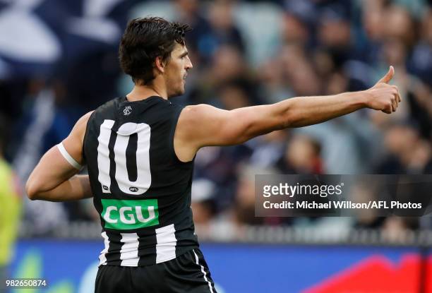 Scott Pendlebury of the Magpies celebrates a goal during the 2018 AFL round 14 match between the Collingwood Magpies and the Carlton Blues at the...