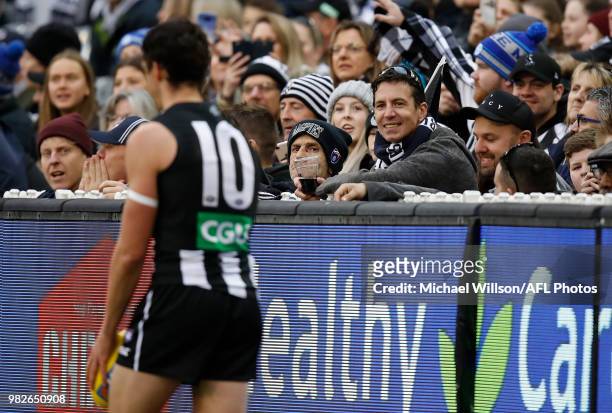 Crowd members attempt to distract Scott Pendlebury of the Magpies as he lines up for goal during the 2018 AFL round 14 match between the Collingwood...