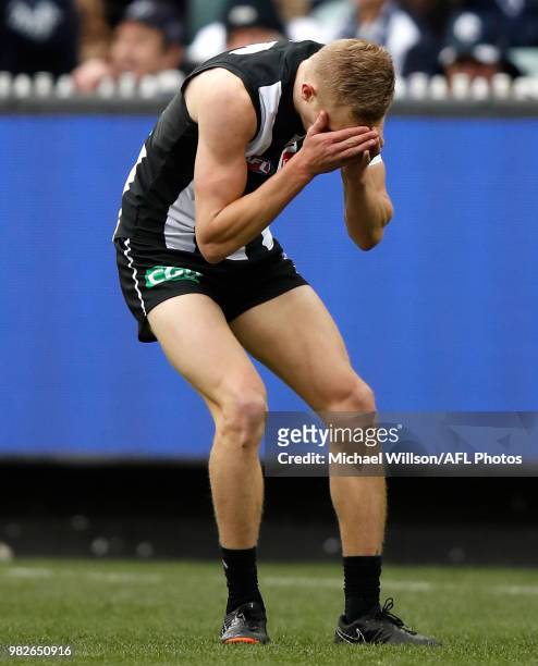 Jaidyn Stephenson of the Magpies rues a missed shot on goal during the 2018 AFL round 14 match between the Collingwood Magpies and the Carlton Blues...