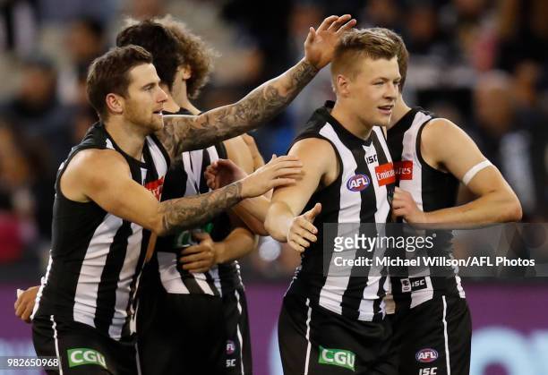 Jeremy Howe of the Magpies and Jordan De Goey of the Magpies celebrate during the 2018 AFL round 14 match between the Collingwood Magpies and the...