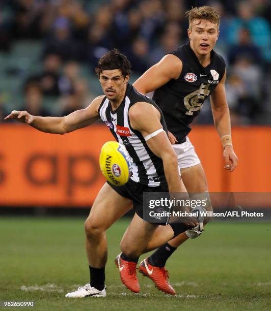 Scott Pendlebury of the Magpies and Patrick Cripps of the Blues in action during the 2018 AFL round 14 match between the Collingwood Magpies and the...