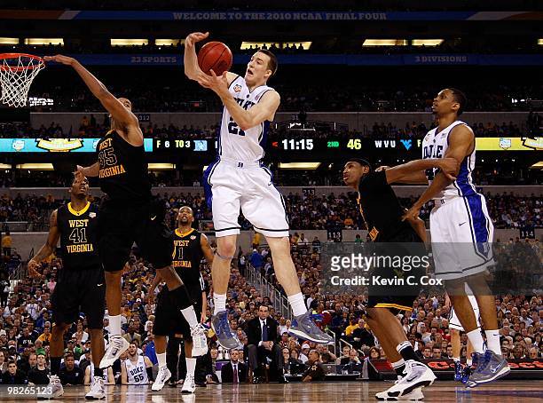 Miles Plumlee of the Duke Blue Devils rebounds the ball while taking on the West Virginia Mountaineers during the National Semifinal game of the 2010...