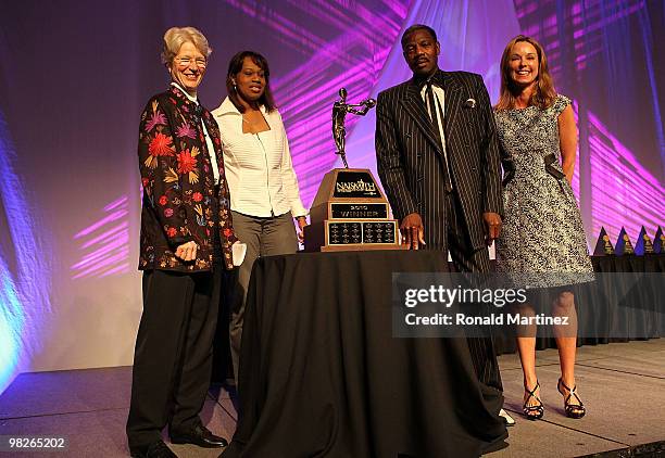 Representative Kris Rinne, Angella Holgate and Rawlston Charles, parents of Tina Charles of the Connecticut Huskies and Tip Off Club representative...