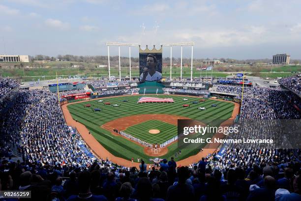 Players for the Detroit Tigers and Kansas City Royals stand on the field during pre-game festivities for the season opener on April 5, 2010 at...