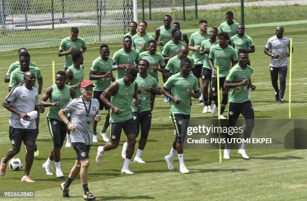 Nigeria's players warm up during a training session at Essentuki Arena in southern Russia on June 24 during the Russia 2018 World Cup football...