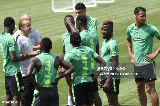 Nigeria's German coach Gernot Rohr speaks to his players during a training session at Essentuki Arena in southern Russia on June 24 during the Russia...