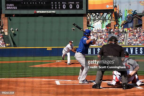 Derek Lowe of the Atlanta Braves throws the first pitch of the game to Ryan Theriot of the Chicago Cubs during Opening Day at Turner Field on April...