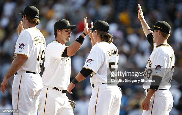 Garrett Jones of the Pittsburgh Pirates celebrates with teammates after a 11-5 win over the Los Angeles Dodgers during the Home Opener for the...