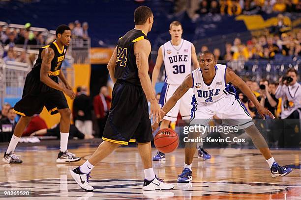 Nolan Smith of the Duke Blue Devils plays defense on Joe Mazzulla of the West Virginia Mountaineers during the National Semifinal game of the 2010...