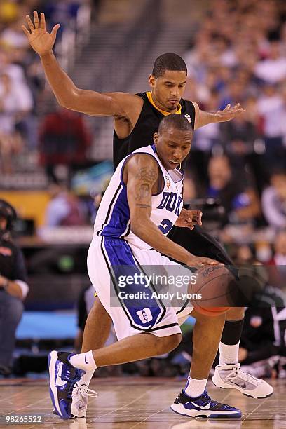 Nolan Smith of the Duke Blue Devils moves the ball against the West Virginia Mountaineers during the National Semifinal game of the 2010 NCAA...