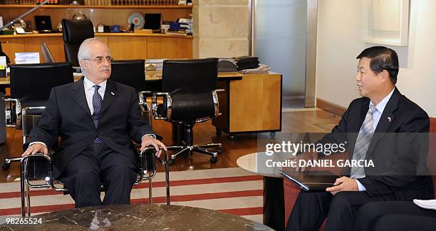 Argentine Foreign Minister Jorge Taiana receives China's ambassador to Argentina, Gang Zen, during a meeting in his office at the Ministry of Foreign...