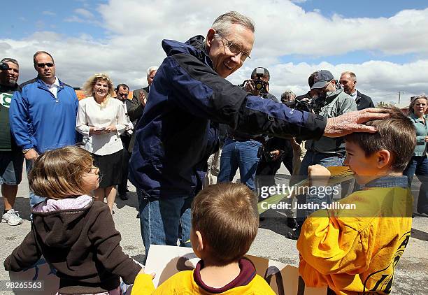 Senate Majority Leader Harry Reid greets supporters in front of the local International Association of Firefighters office April 5, 2010 in Pahrump,...