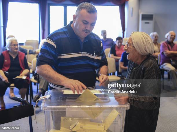 Voter casts her ballot in a nursing home during the parliamentary and presidential elections, in Ankara, Turkey on June 24, 2018. Polling in Turkeys...