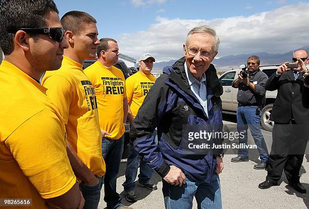 Senate Majority Leader Harry Reid talks with Pahrump firefighters in front of the local International Association of Firefighters office April 5,...