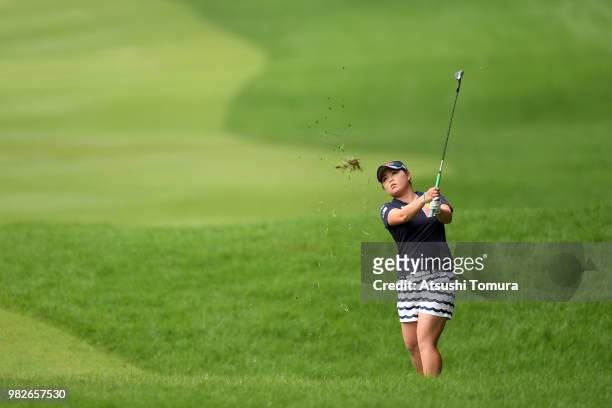 Hiroko Azuma of Japan hits her third shot on the 18th hole during the final round of the Earth Mondahmin Cup at the Camellia Hills Country Club on...