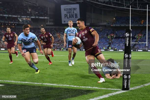 Valentine Holmes of the Maroons scores a try during game two of the State of Origin series between the New South Wales Blues and the Queensland...