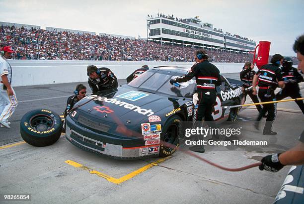 Hooters 500: Dale Earnhardt during pit stop of race at Atlanta Motor Speedway. Hampton, GA CREDIT: George Tiedemann