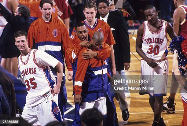 Big East Tournament: Syracuse Donovan McNabb victorious, hugging teammate on court after winning game vs Boston College. New York, NY 3/7/1996...