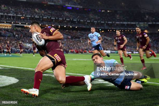 Valentine Holmes of the Maroons scores a try during game two of the State of Origin series between the New South Wales Blues and the Queensland...