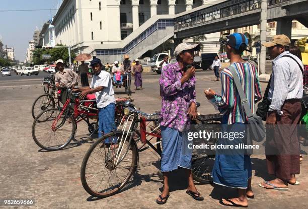 Bicycle Taxi drivers wear the traditional sheet of cloth "Longyi" in Rangun, Myanmar, 20 February 2017. The fashion chain "Zara" has been widely...