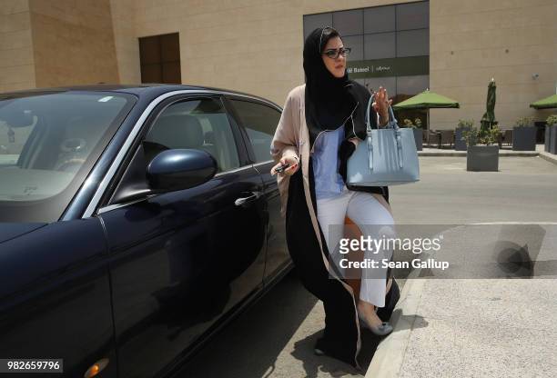 Saudi lawyer and businesswoman Sofana Dahlan perpares to get in her car after going for coffee to a cafe on the first day she is legally allowed to...
