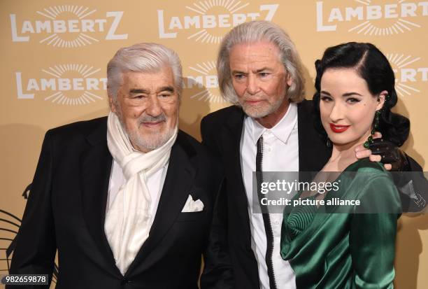 Lambertz manager Hermann Buehlbecker welcomes actor Mario Adorf and burlesque artist Dita Von Teese at the 'Lambertz Monday Night' event in Cologne,...