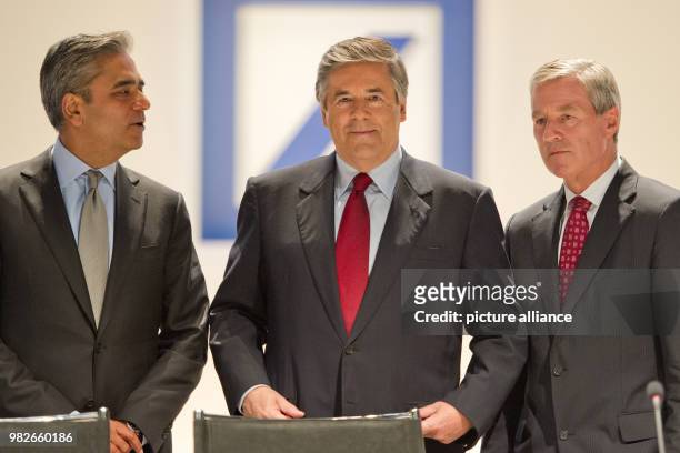 An archive picture, taken on 31 May 2011, shows Josef Ackermann , former CEO of Deutsche Bank, standing next to his successors Anshu Jain and Juergen...
