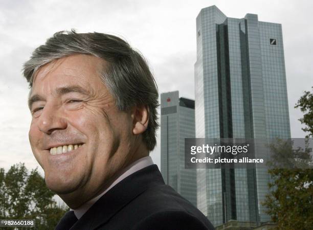 Former CEO of the Deutsche Bank, Josef Ackermann, smiles in front of the twin towers of the Deutsche Bank in Frankfurt am Main, Germany, 17 November...