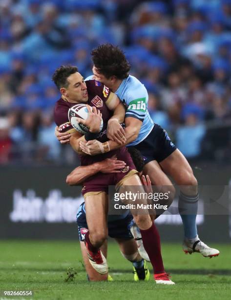 Billy Slater of the Maroons is tackled by James Roberts of the Blues during game two of the State of Origin series between the New South Wales Blues...