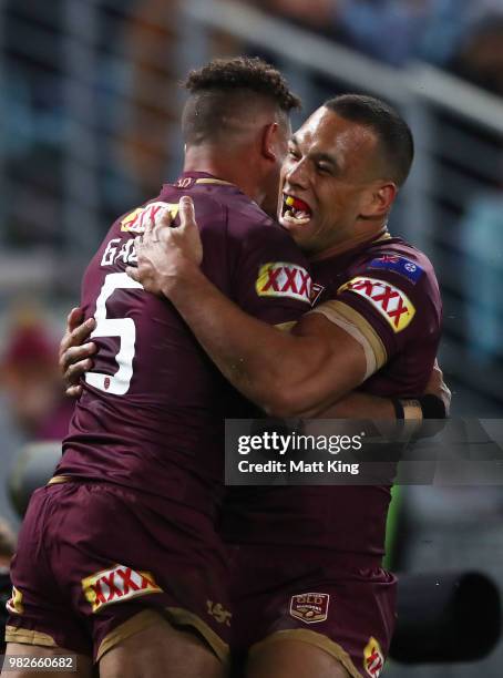 Dane Gagai of the Maroons celebrates with Will Chambers after scoring a try during game two of the State of Origin series between the New South Wales...