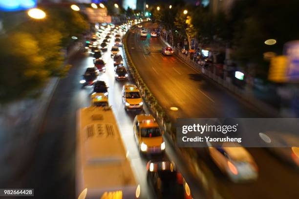 blurred city night traffic background - thruway stock-fotos und bilder
