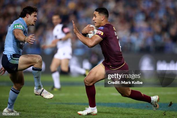 Valentine Holmes of the Maroons makes a break during game two of the State of Origin series between the New South Wales Blues and the Queensland...