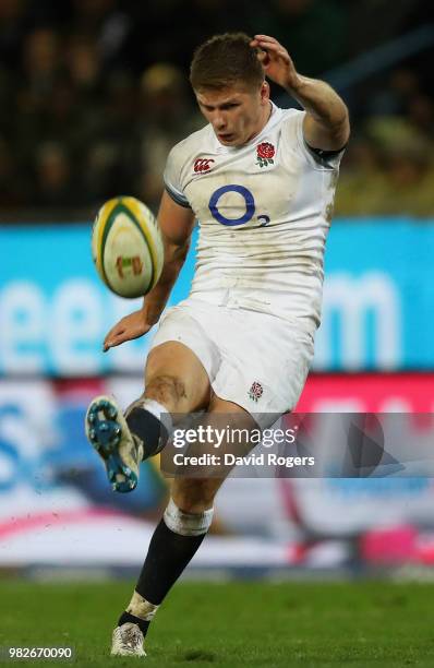 Owen Farrell of England kicks the ball upfield during the third test match between South Africa and England at Newlands Stadium on June 23, 2018 in...